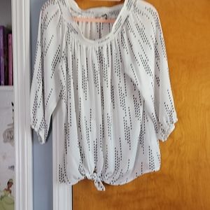 White / black polkadot shirt